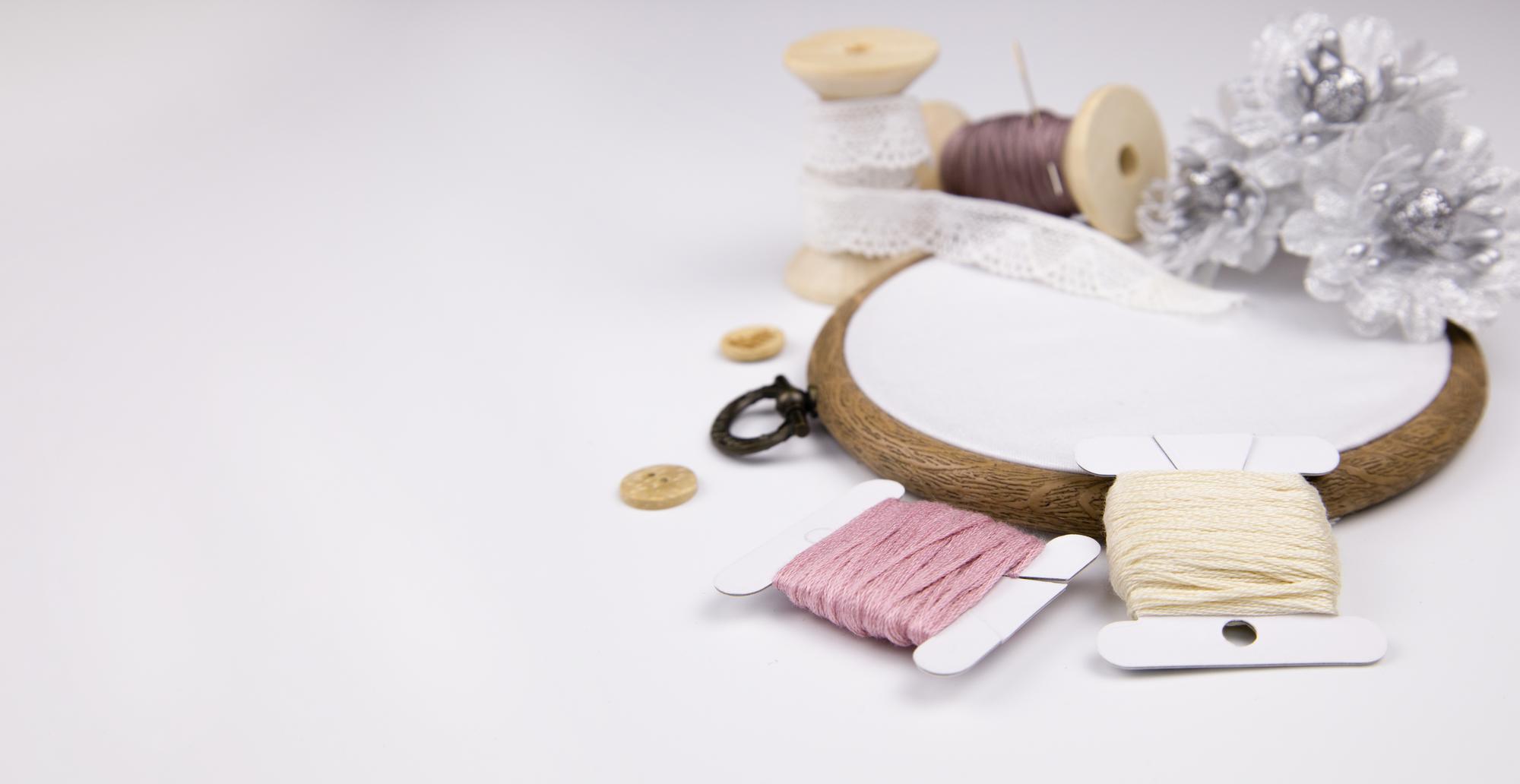 Studio workspace with threads and hoops